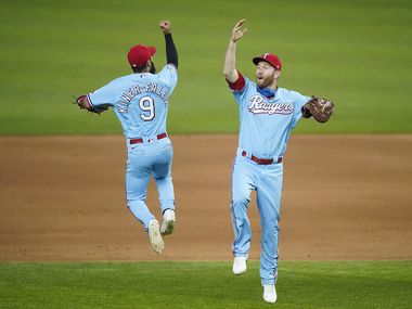 Texas Rangers third base Isiah Kiner-Falefa celebrates with first baseman Todd Frazier after a 7-3 victory for a series sweep of the Los Angeles Angels at Globe Life Field on Sunday, Aug. 9, 2020.