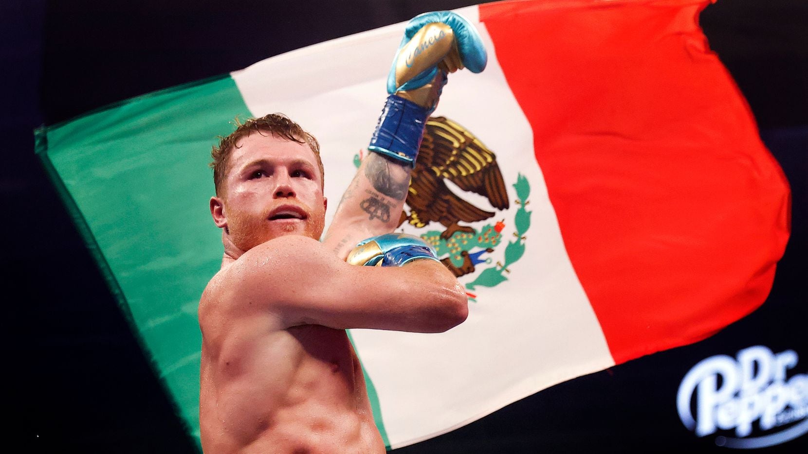 Boxers Canelo Alvarez celebrates after defeating Billy Joe Saunders in the eighth round of...