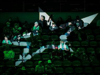 Dallas Stars fans take their seats before an NHL hockey game against the Florida Panthers at...