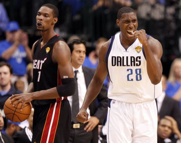 Dallas center Ian Mahinmi (28) celebrates after forcing Miami to turn over the ball on a...