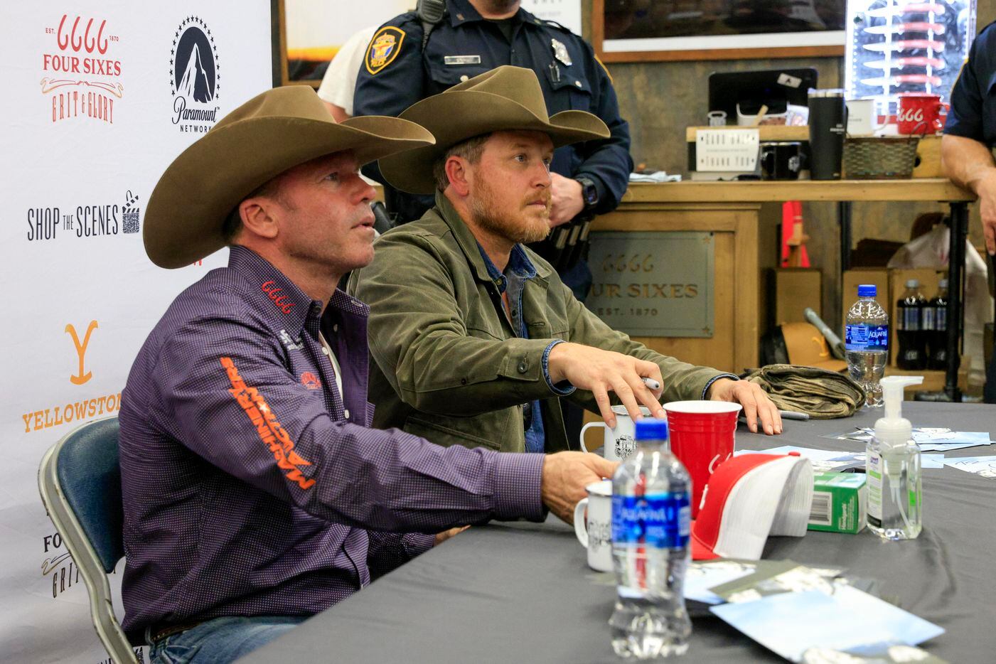“Yellowstone” creator Taylor Sheridan (left) and actor Cole Hauser talk with fans as they...