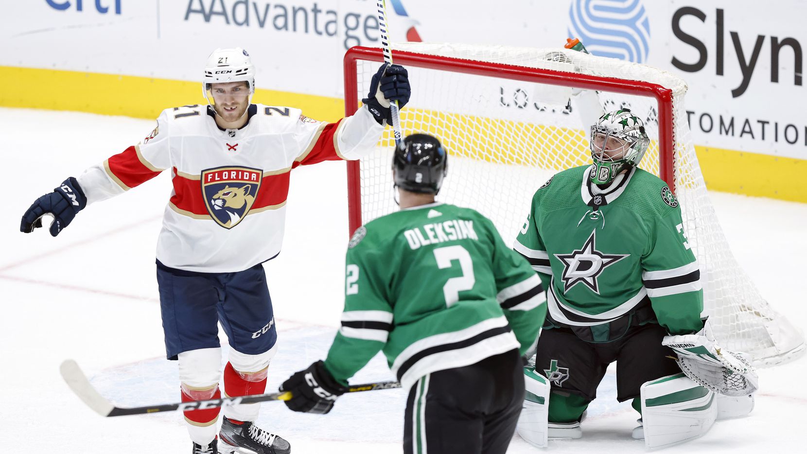 Florida Panthers center Alex Wennberg (21) celebrates center Frank Vatrano's overtime goal on Dallas Stars goaltender Anton Khudobin (35) at the American Airlines Center in Dallas, Tuesday, April 13, 2021. The Stars lost, 3-2.