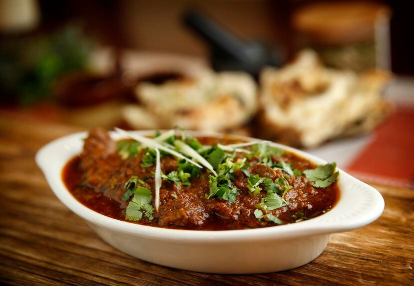 Kolhapuri mutton with naan is a spicy favorite at Sawaii Indian Restaurant.
