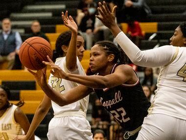 Coppell's India Howard (22) is surrounded by Plano East defenders during Plano East's 42-37 win Tuesday.