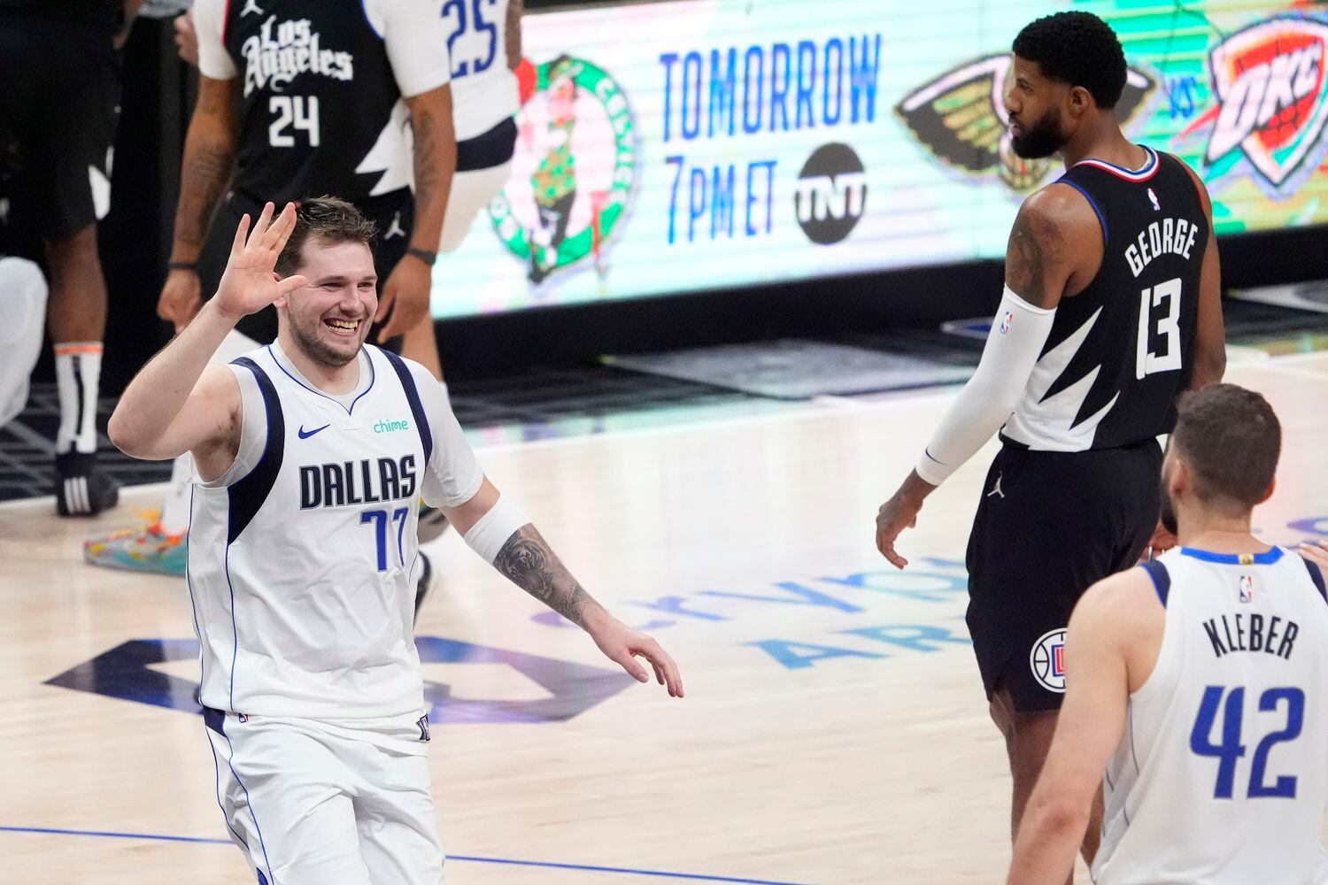 Dallas Mavericks guard Luka Doncic, left, celebrates with forward Maxi Kleber, right, as Los...