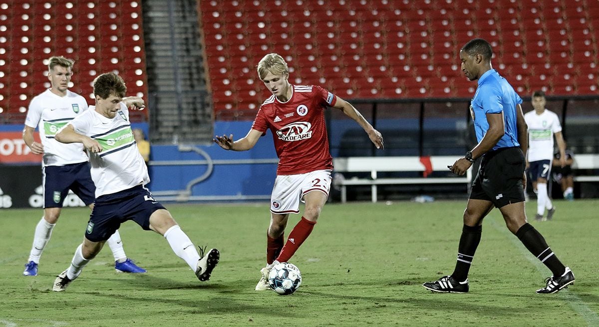 Thomas Roberts of FC Dallas and North Texas SC dribbles in traffic during the USL League One...