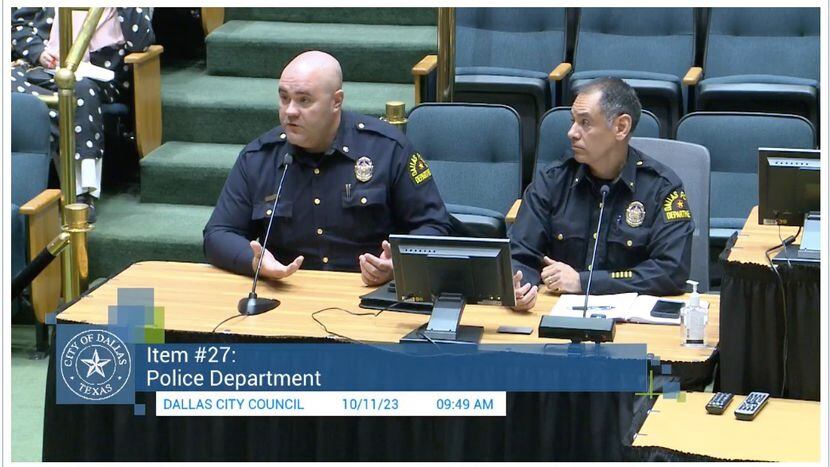 Dallas police Major Devon Palk, left, answers questions Wednesday at Dallas City Hall about...