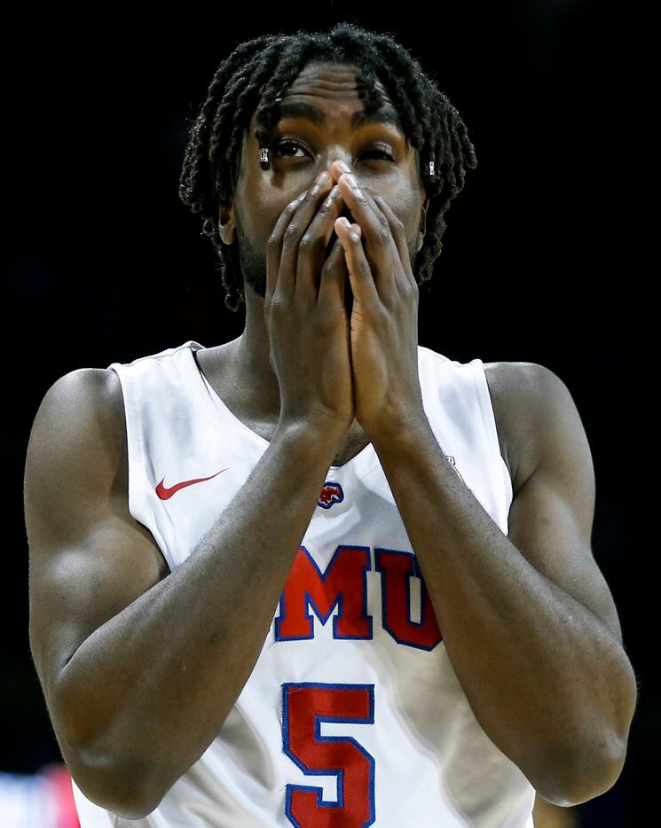 Southern Methodist Mustangs guard Emmanuel Bandoumel (5) reacts to a call turning the ball...