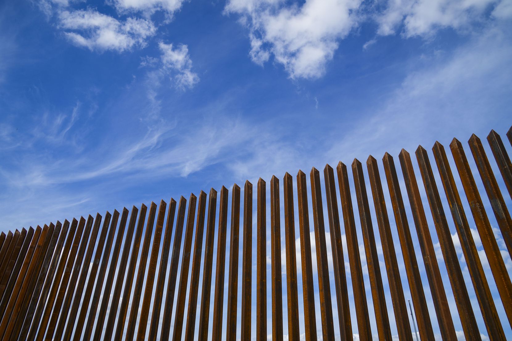A section of border fence consisting of steel bollard panels near Texas Highway 480 in Eagle...
