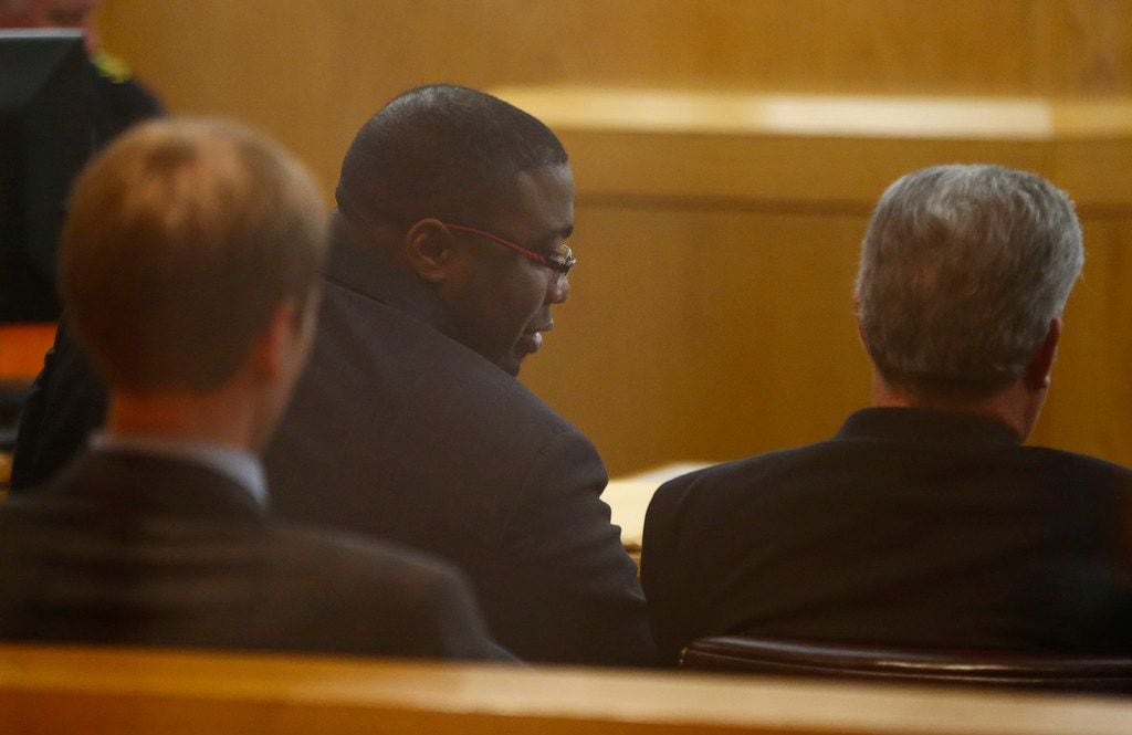Antonio Cochran talks to his lawyers before being found guilty of murder Saturday.