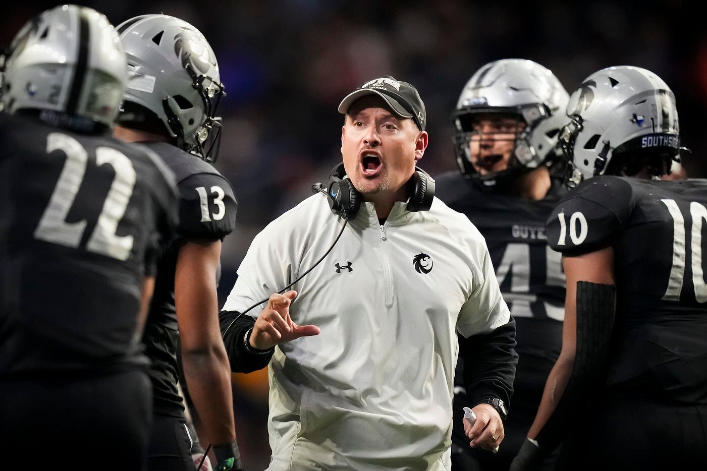 Denton Guyer head coach Reed Heim instructs his players during the first half of a Class 6A...