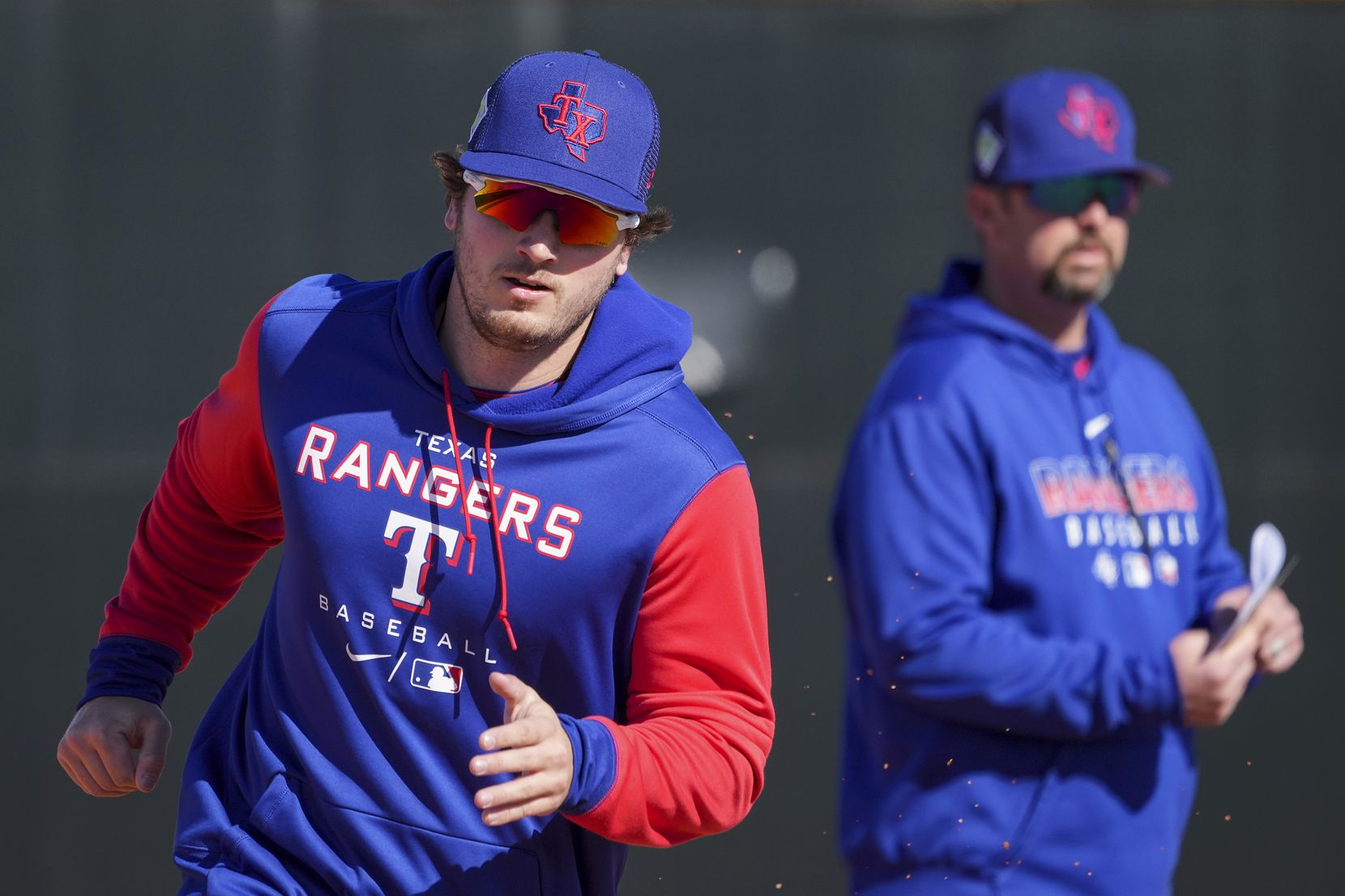 Outfielder Trevor Hauver participates in a base running drill during a Texas Rangers minor...