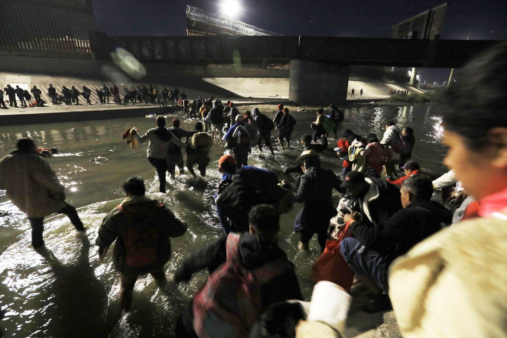 Hundreds of migrants made their way from Ciudad Juarez to El Paso on Dec. 11.