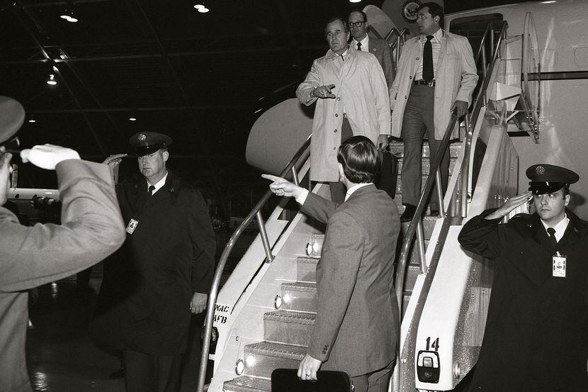 1981: While sharpshooters watched from the hangar roof, Vice President Bush arrives at...