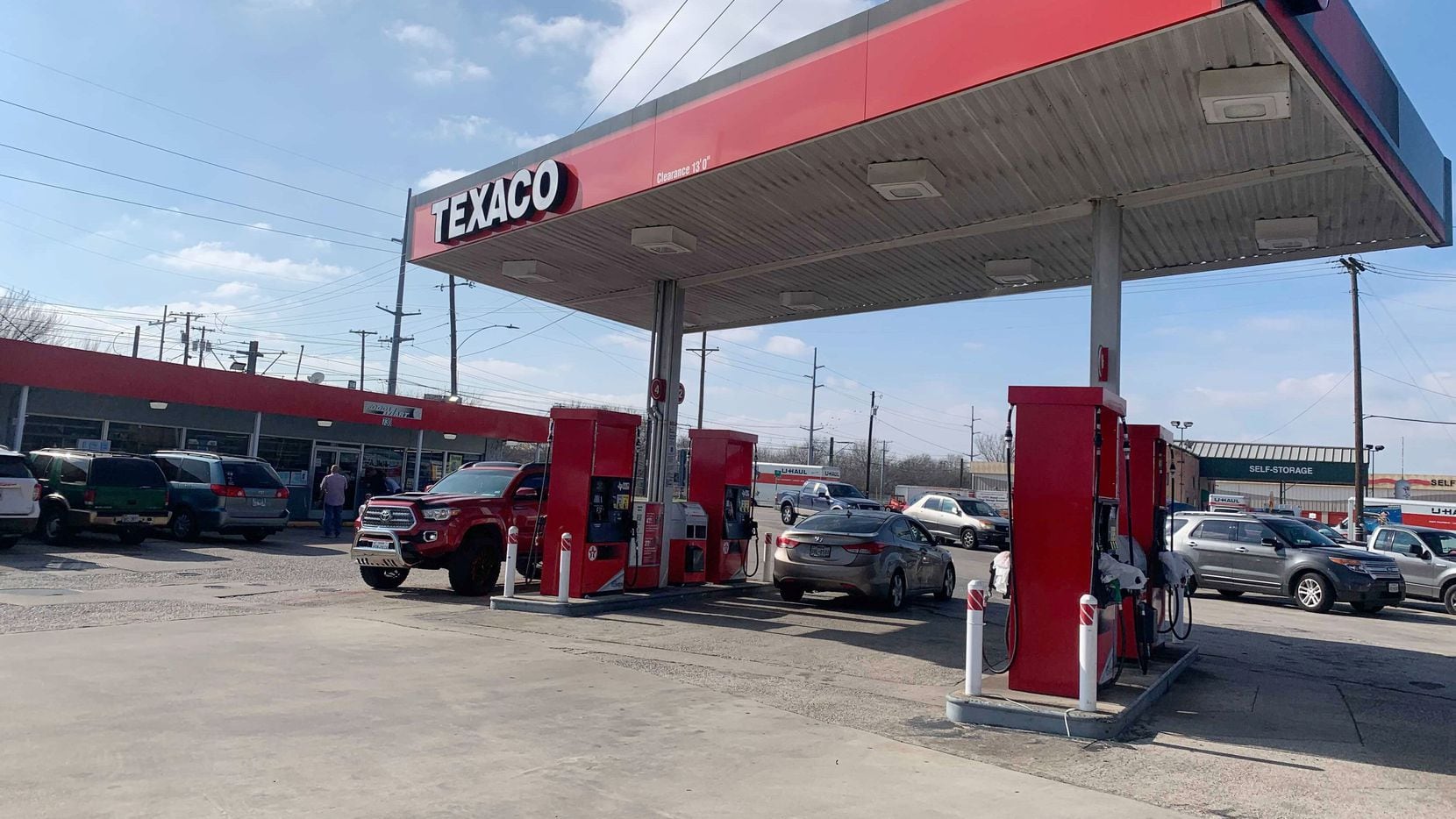 The Texaco station where three men were dead after a shooting inside the gas station in...