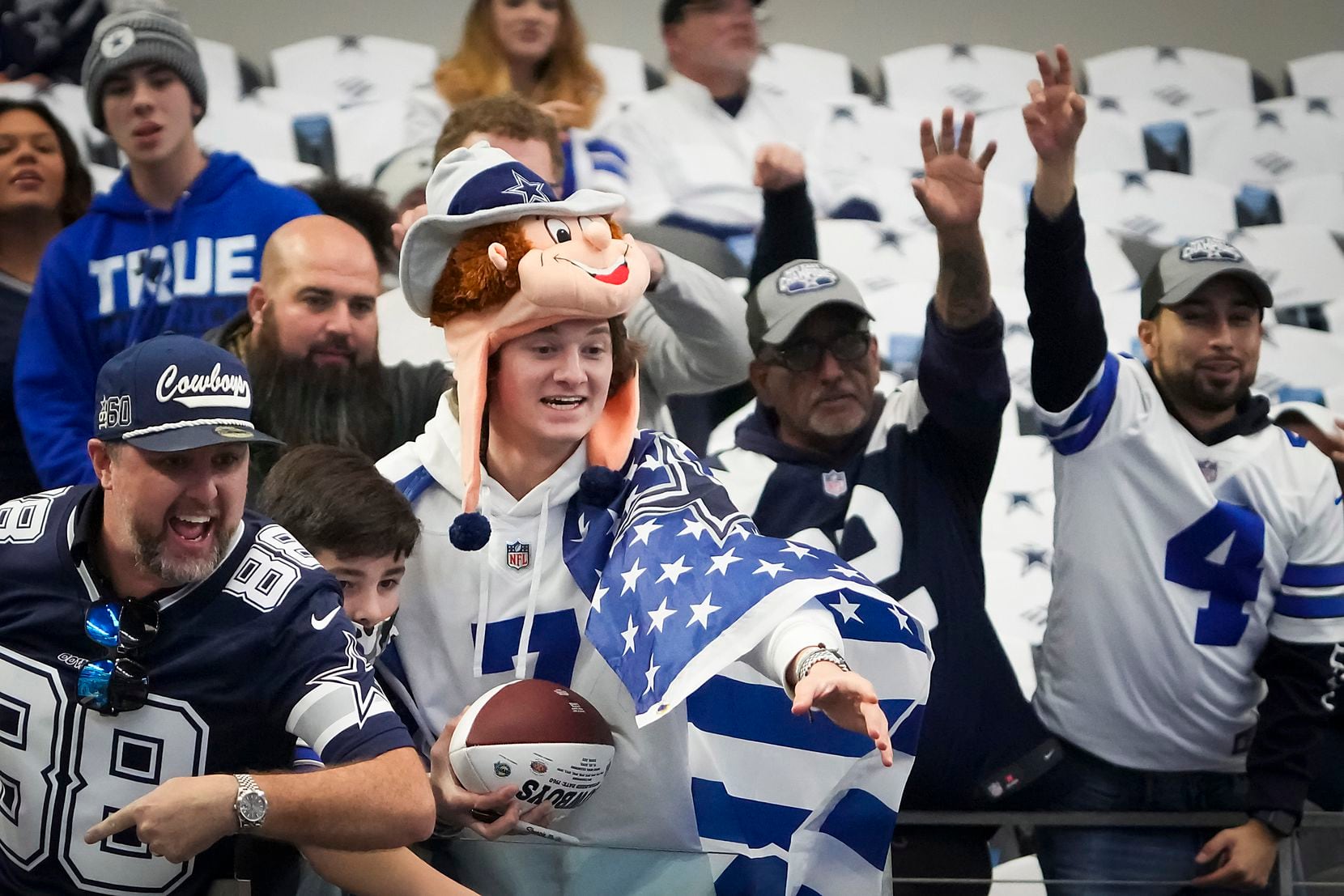 Dallas Cowboys fans cheer at the team warms up before an NFL Wild Card playoff football game...