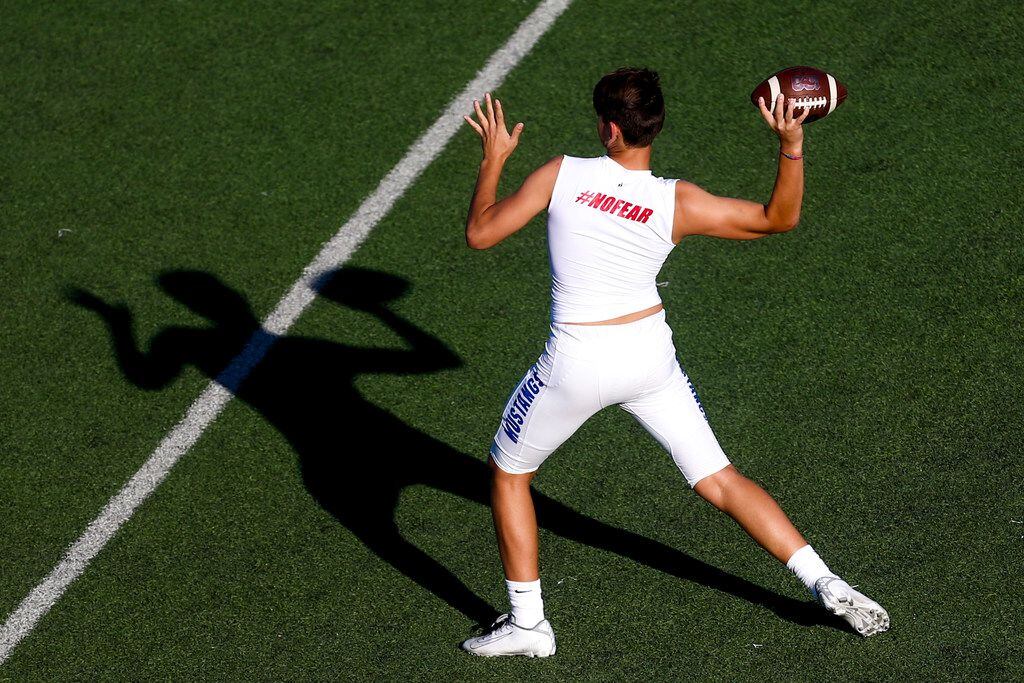 A Grapevine player warms up before a high school football game between Northwest and...