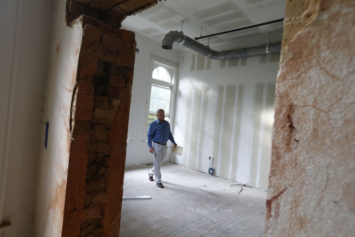 Developer Allan Brown in a room under construction in the historic Davy Crockett School,...