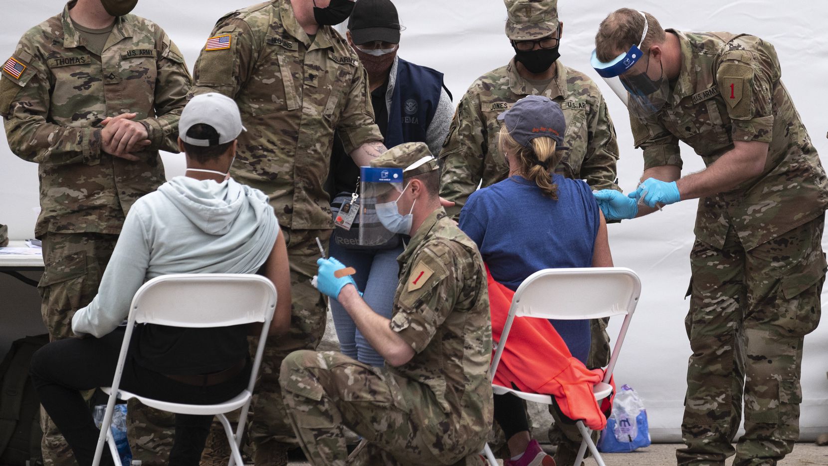 U.S. Army personnel conduct COVID-19 vaccinations at the Dallas site at Fair Park, on...