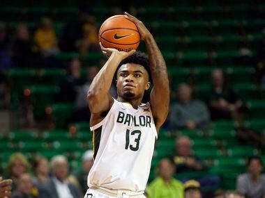 Baylor guard Langston Love (13) shoots during the second half of an NCAA college basketball...