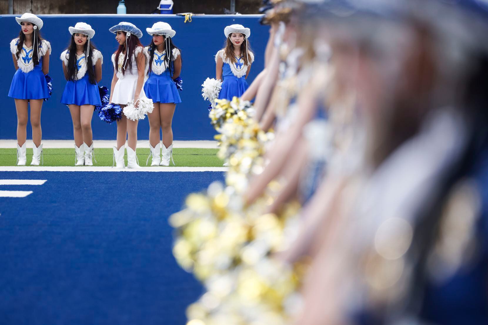 McKinney Marquettes, right, and Temple High Kittens line up after a season-opening football...