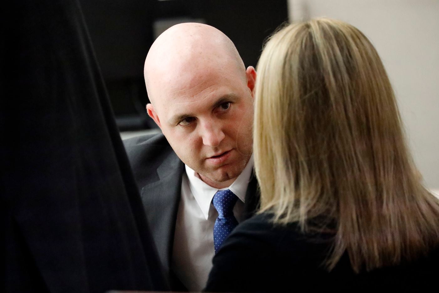 Fired Dallas police Officer Amber Guyger visits with her attorney Zach Horn (left) during a break in her murder trial in the 204th District Court at the Frank Crowley Courts Building in Dallas, Thursday, September 26, 2019. 