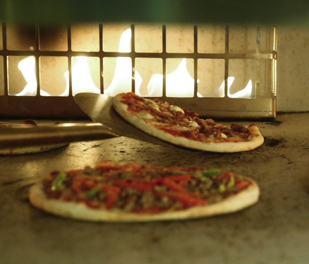 Personal pizza pies are made to order from the lunch menu of the new Coal Vines located...