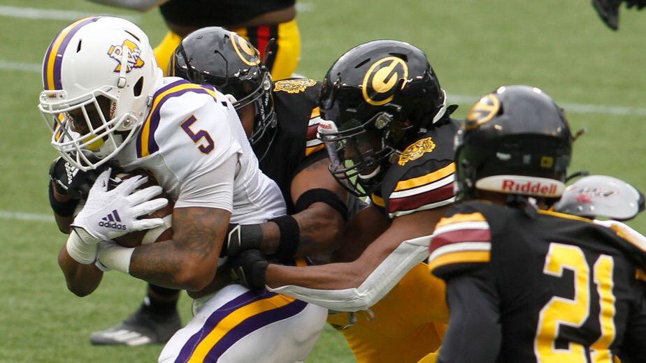 Prairie View A&M's Ahmad Antoine (5) picks up a first down as he attracted the attention of...
