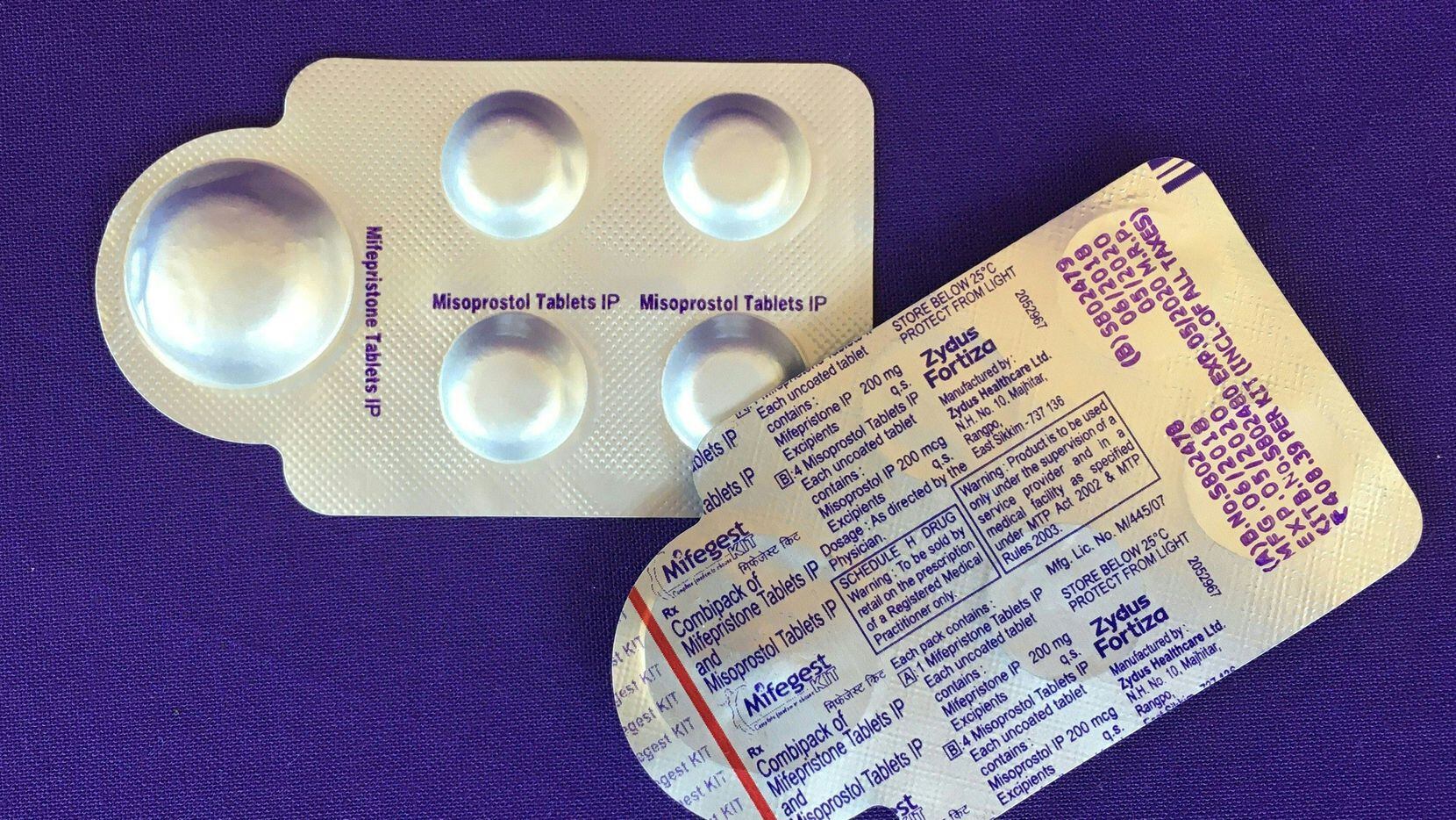 Image dated May 8, 2020, shows a combination pack of mifepristone, left, and misoprostol...
