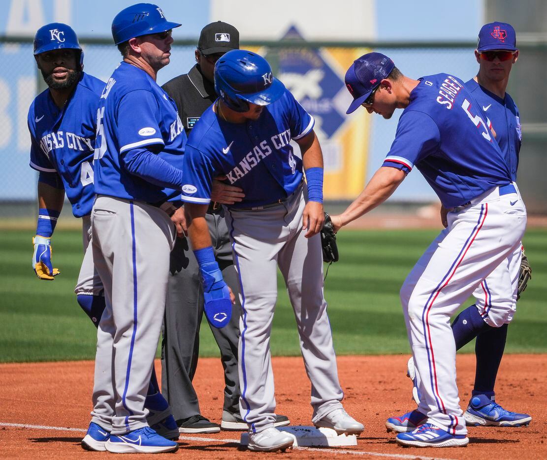 Texas Rangers shortstop Corey Seager (5) puts a tag on Kansas City Royals second baseman...