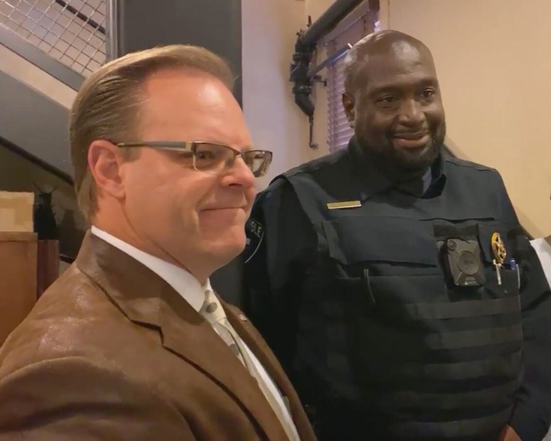 Ellis County Judge Todd Little, left, listens to Ellis County Precinct 3 Constable Curtis Polk talk about the covering up of the segregation-era 'Negroes' sign during a Facebook Live on Wednesday, November 18, 2020 at the Ellis County Courthouse in Waxahachie, Texas. (Photo courtesy Ellis County.)