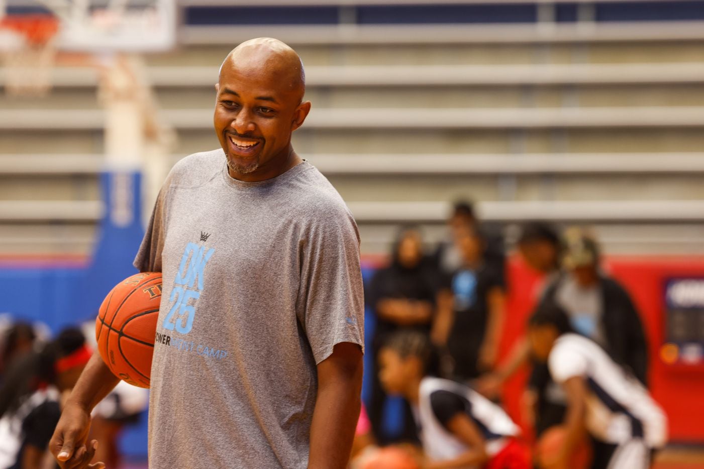 Darren Kelly smiles during the EmPOWERment camp with former Duncanville state champion Deja...