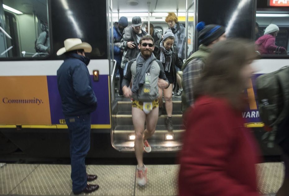Dart riders exit the train at Cityplace/Uptown Station in their underwear during the No...