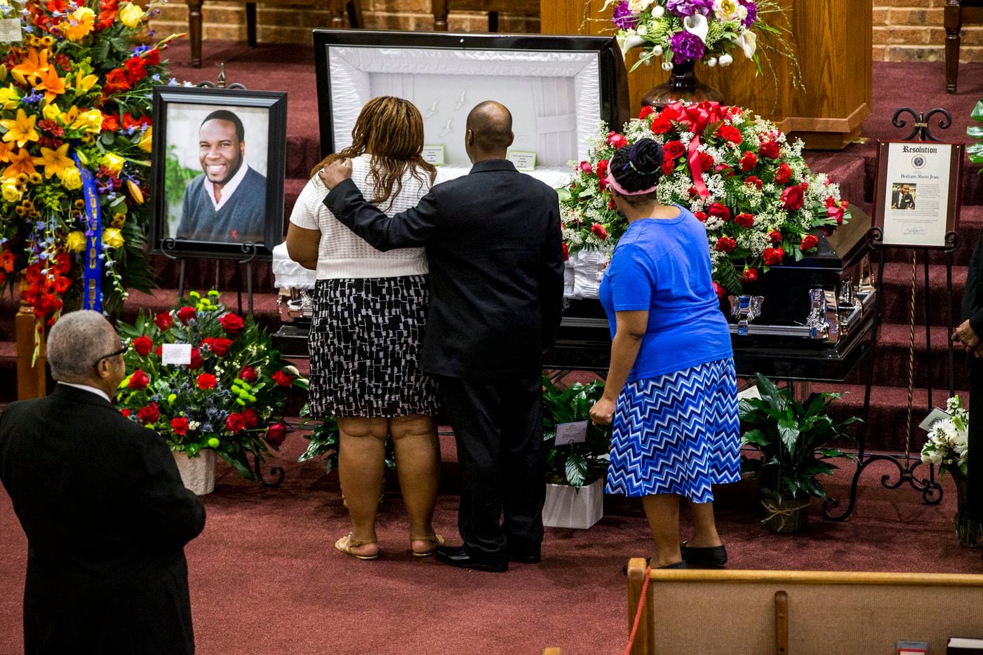 Mourners console each other during the public viewing before the funeral of Botham Shem Jean at the Greenville Avenue Church of Christ on Thursday, September 13, 2018 in Richardson, Texas. He was shot and killed by a Dallas police officer in his apartment last week in Dallas. (Shaban Athuman/ The Dallas Morning News)