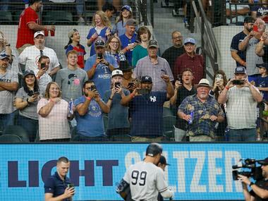 Fans cheer on New York Yankees right fielder Aaron Judge (99) after he hit his 62nd home run...
