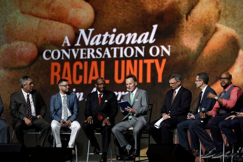 Pastor Ronnie Floyd (center), president of the Southern Baptist Convention, conducted a...