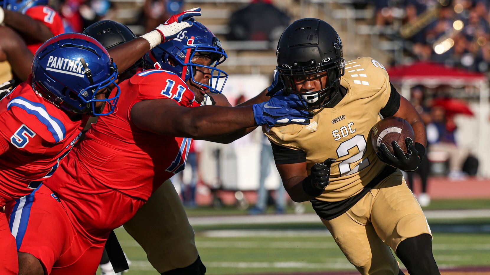 Duncanville High School Elijah Wilson (5) and Micheal January (11) reach for South Oak Cliff...