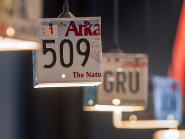 Light shades made of old license plates hang over the bar at Highway 61 South, a blues and...