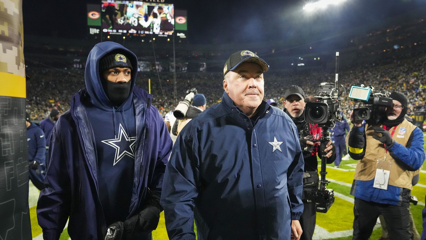 Dallas Cowboys head coach Mike McCarthy leaves the field after an overtime loss to the Green...