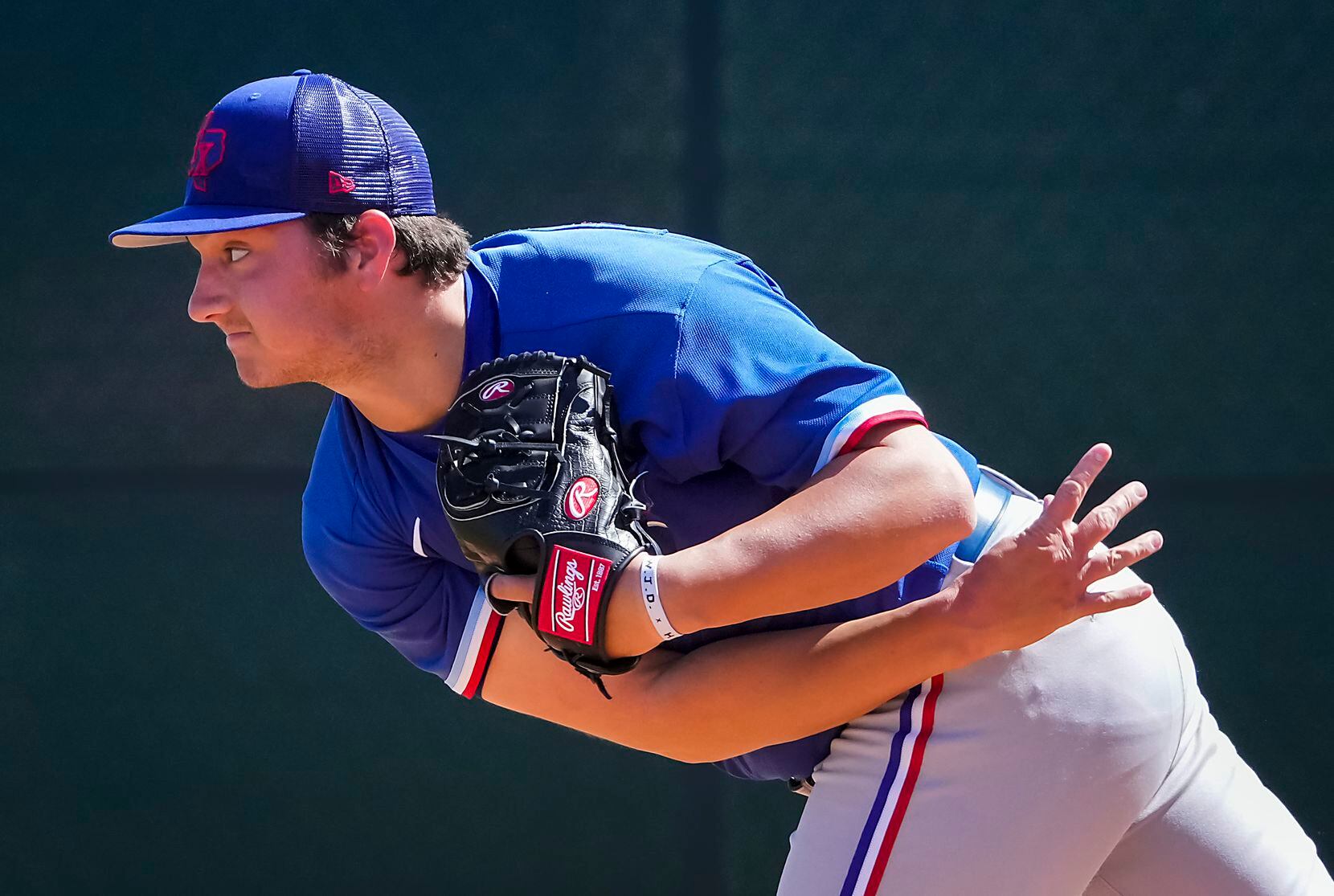 Texas Rangers minor league pitcher Owen White works in the bullpen during a spring training...