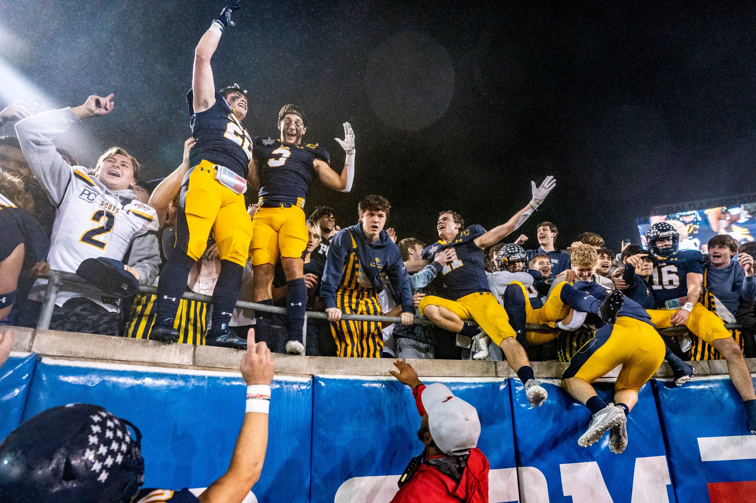Highland Park players celebrate in the student section after beating McKinney 22-21 on a...