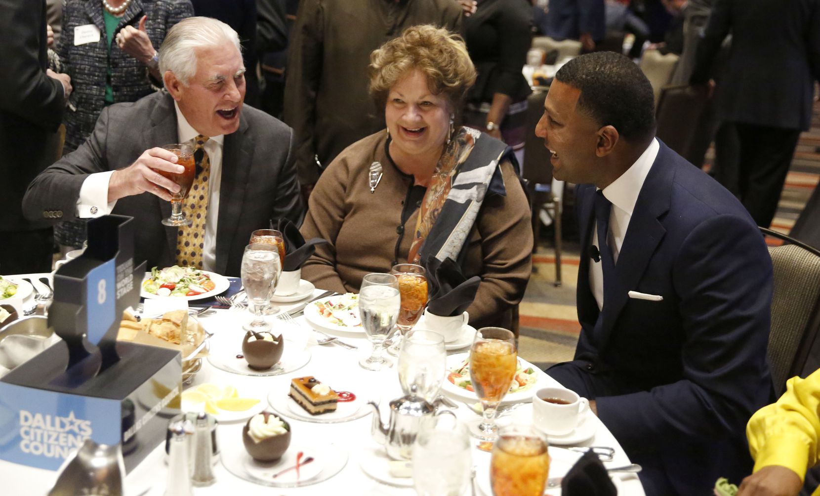 Rex Tillerson (left), former U.S. secretary of state and former chairman and CEO of Exxon Mobil, laughed with his wife, Renda St. Claire, and Fred Perpall before the Dallas Citizens Council meeting at the Hyatt Regency Hotel in December 2018.