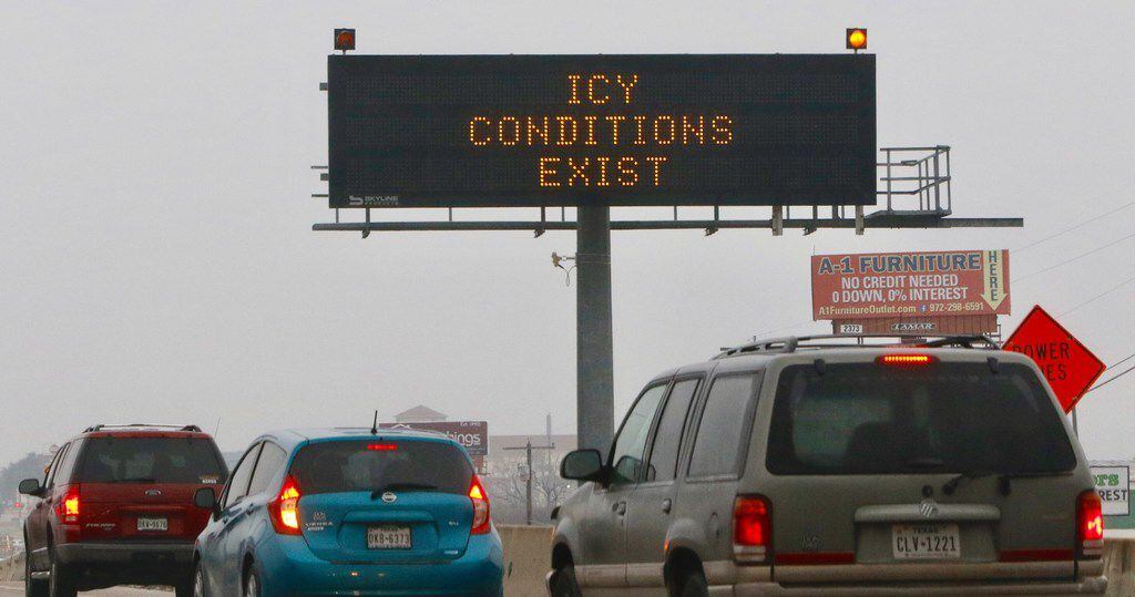 A TXDOT sign warns drivers of icy conditions on Hwy. 67 at the Danieldale Road exit ramp on...