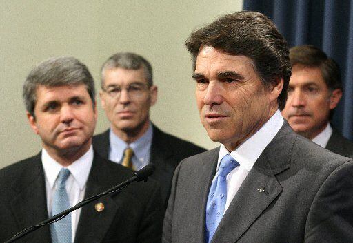 As governor, Rick Perry was joined at an event in Austin by Rep. Michael McCaul (left) and...