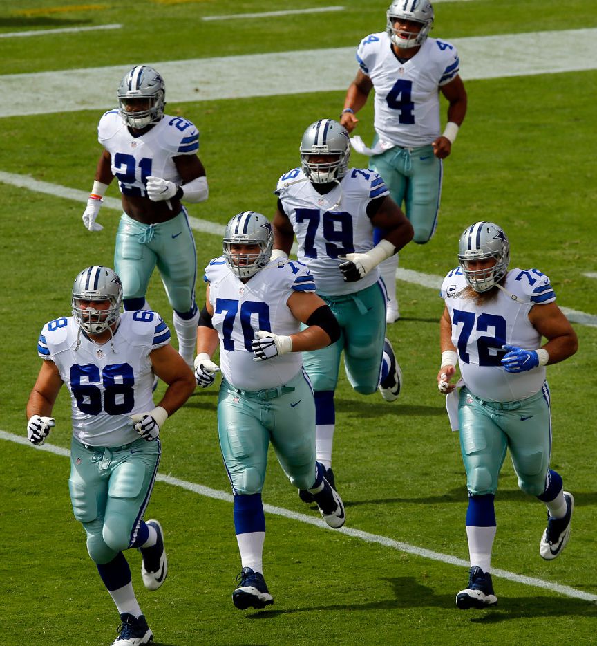 Dallas Cowboys offensive line including tackle Doug Free (68), guard Zack Martin (70),...