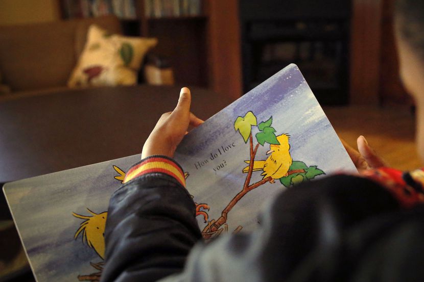 A 7-year-old resident at Jonathan's Place in Garland read a book in March 2016. In its 27th...