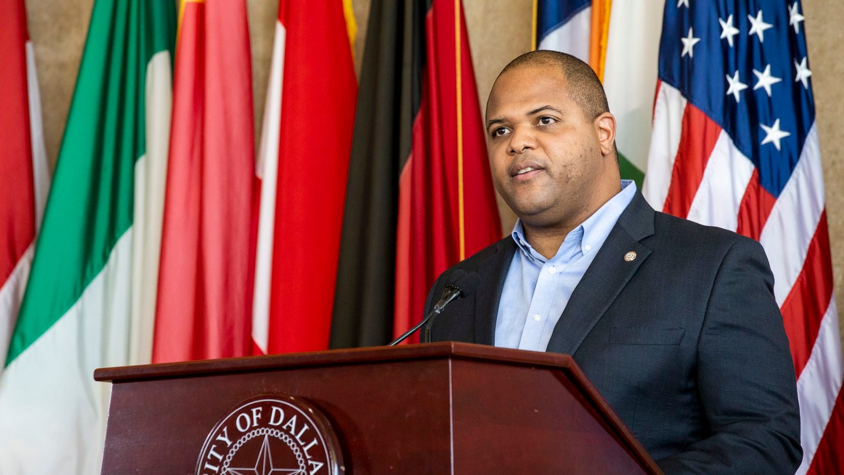 Mayor Eric Johnson announces action passed by the city council to help residents and...