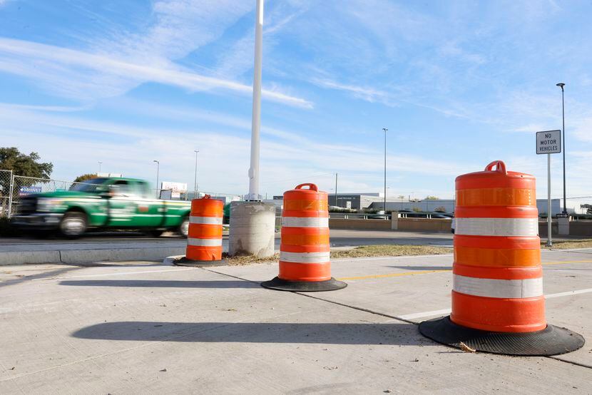Orange traffic barrels are now set up at the bottom of the ramp of the Northaven Trail...