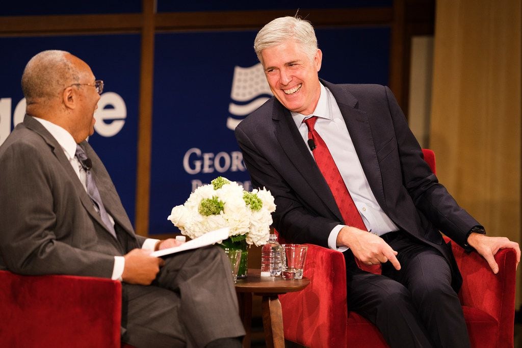 Supreme Court Justice Neil Gorsuch (right) speaks with moderator Larry D. Thompson at the...