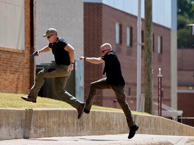 During a training session, Athens Police Officers Zachary Harris (left) and Adam Parkins...